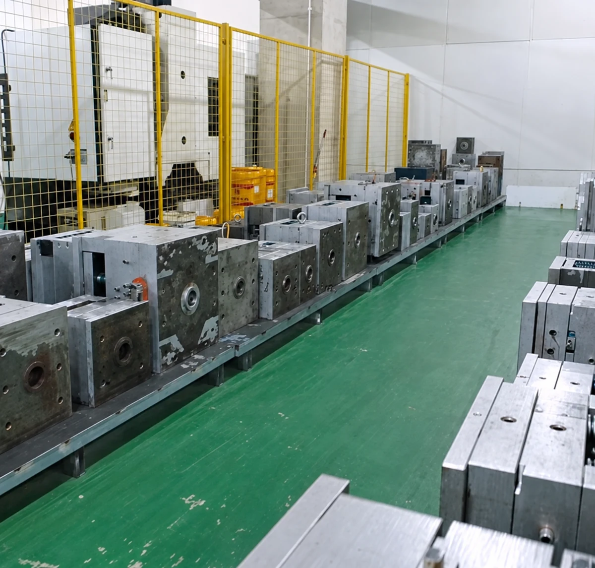 AI-enhanced photograph: Injection molds stored for tooling review